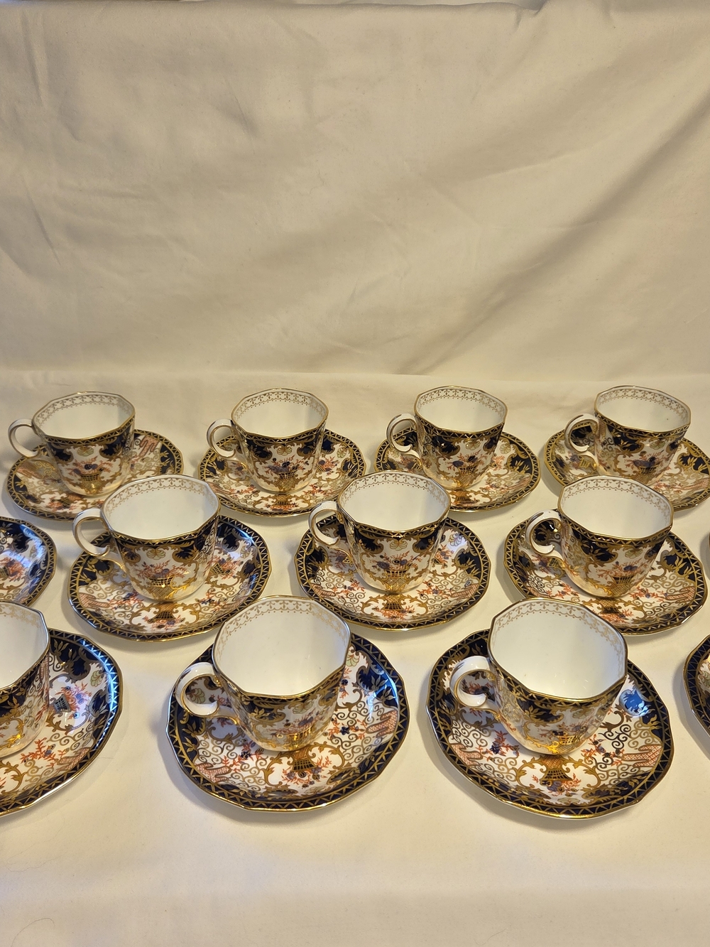 Royal Crown Derby Black, Gold and White Gilt Floral Teacup and Saucer Set